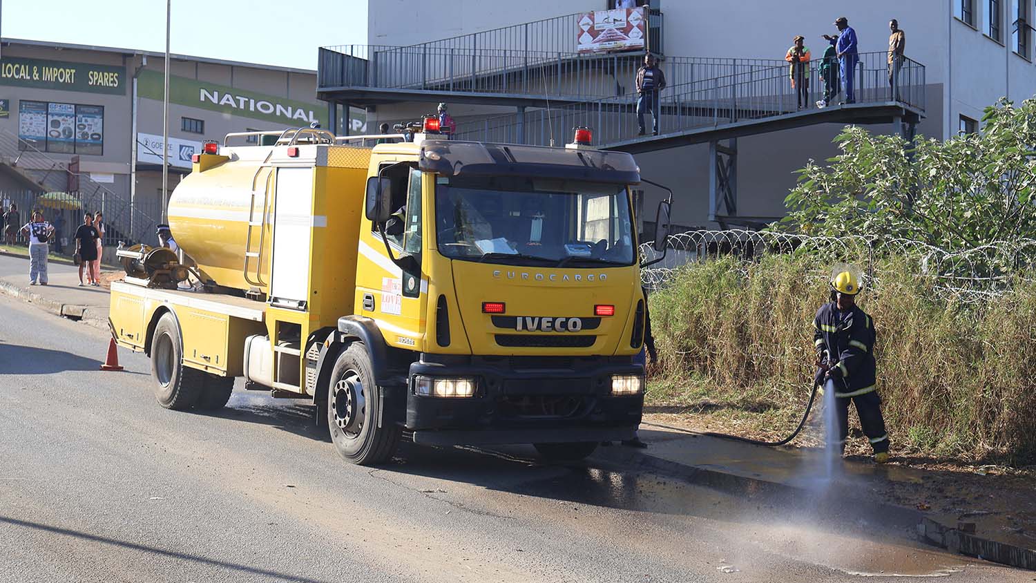 Eswatini National Fire, Rescue and Emergency Services personnel clear the accident scene.